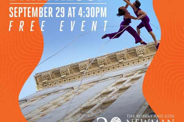 dancers suspended from building by ropes
