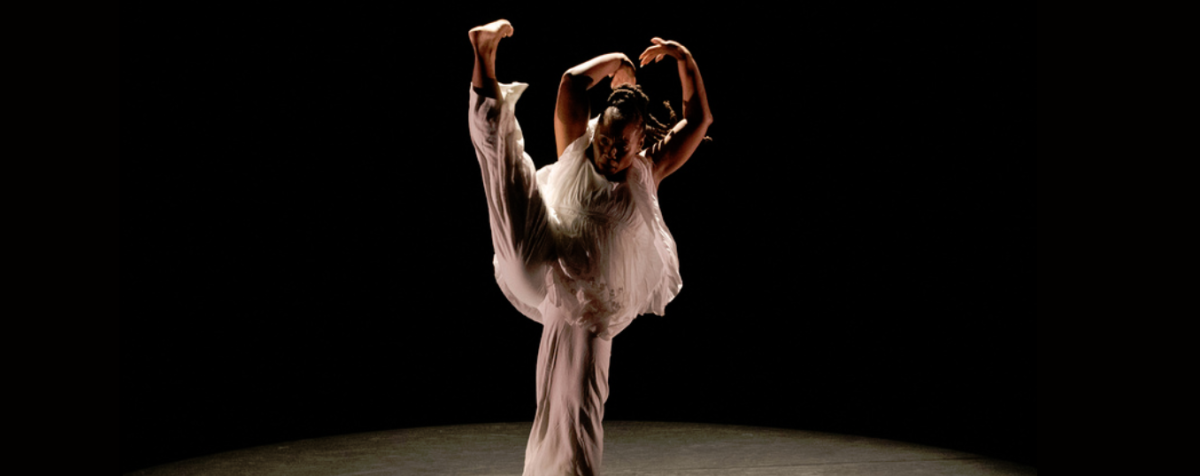 female dancer doing high kick